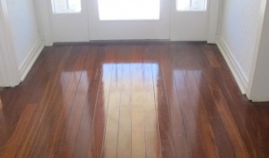 The rich colours of hardwood Jarrah with highly polished surface restored by Profloors
